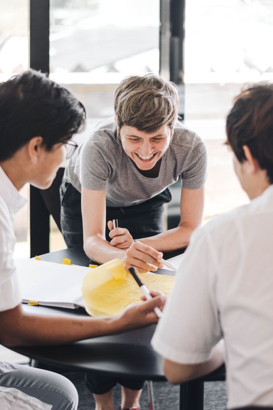 Team members sketching a plan