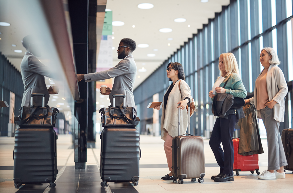 Travelers standing in line at the airport